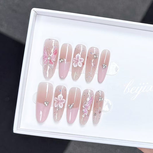 Blush Pink Ombre Almond Press-on Nails with Butterfly and Floral Accents